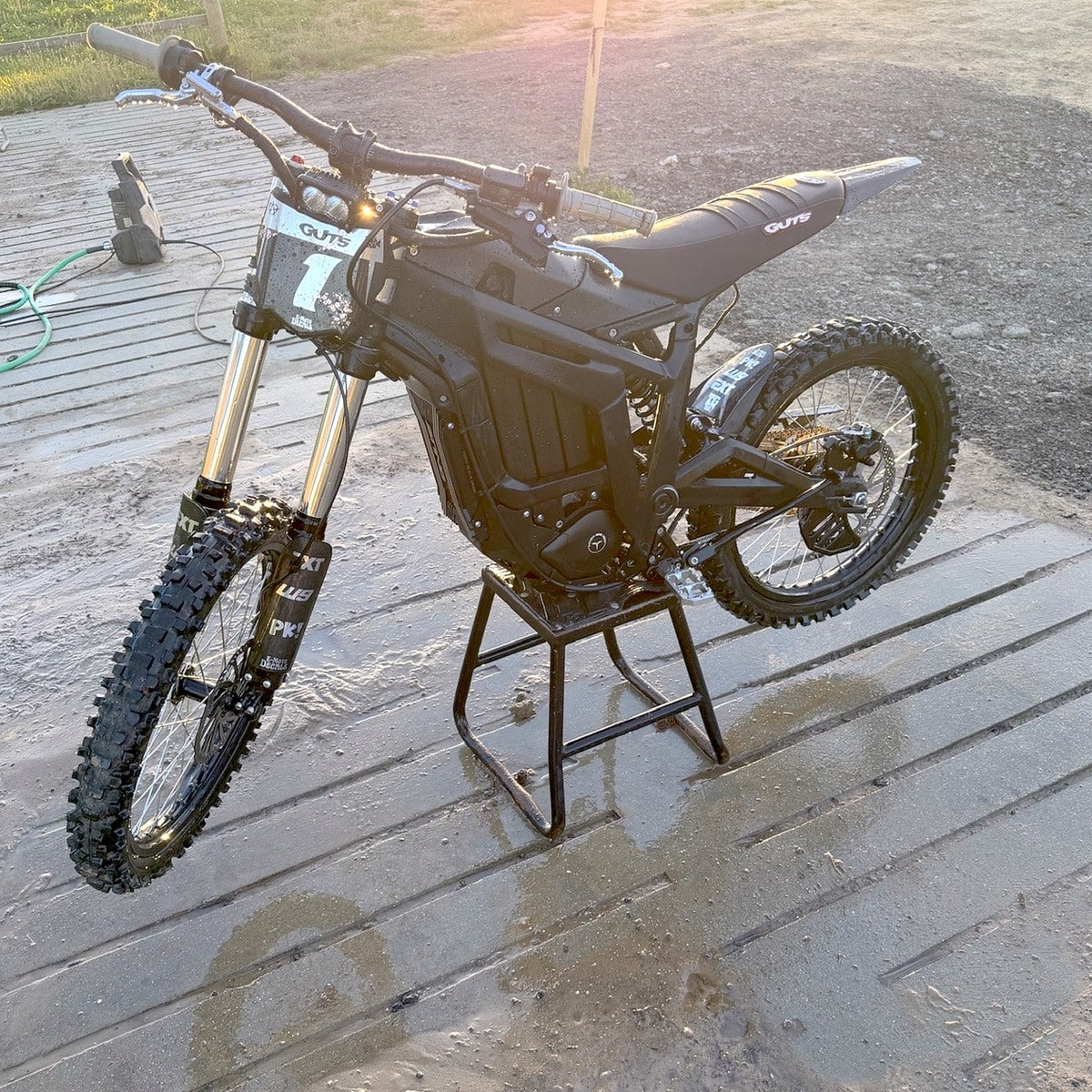Talaria e-moto with E-Moto Decals fork graphics and custom number plate decal at sunset