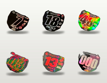 E-Moto Decals ODI number plate decal samples, studio product photo showing six finish and number styles